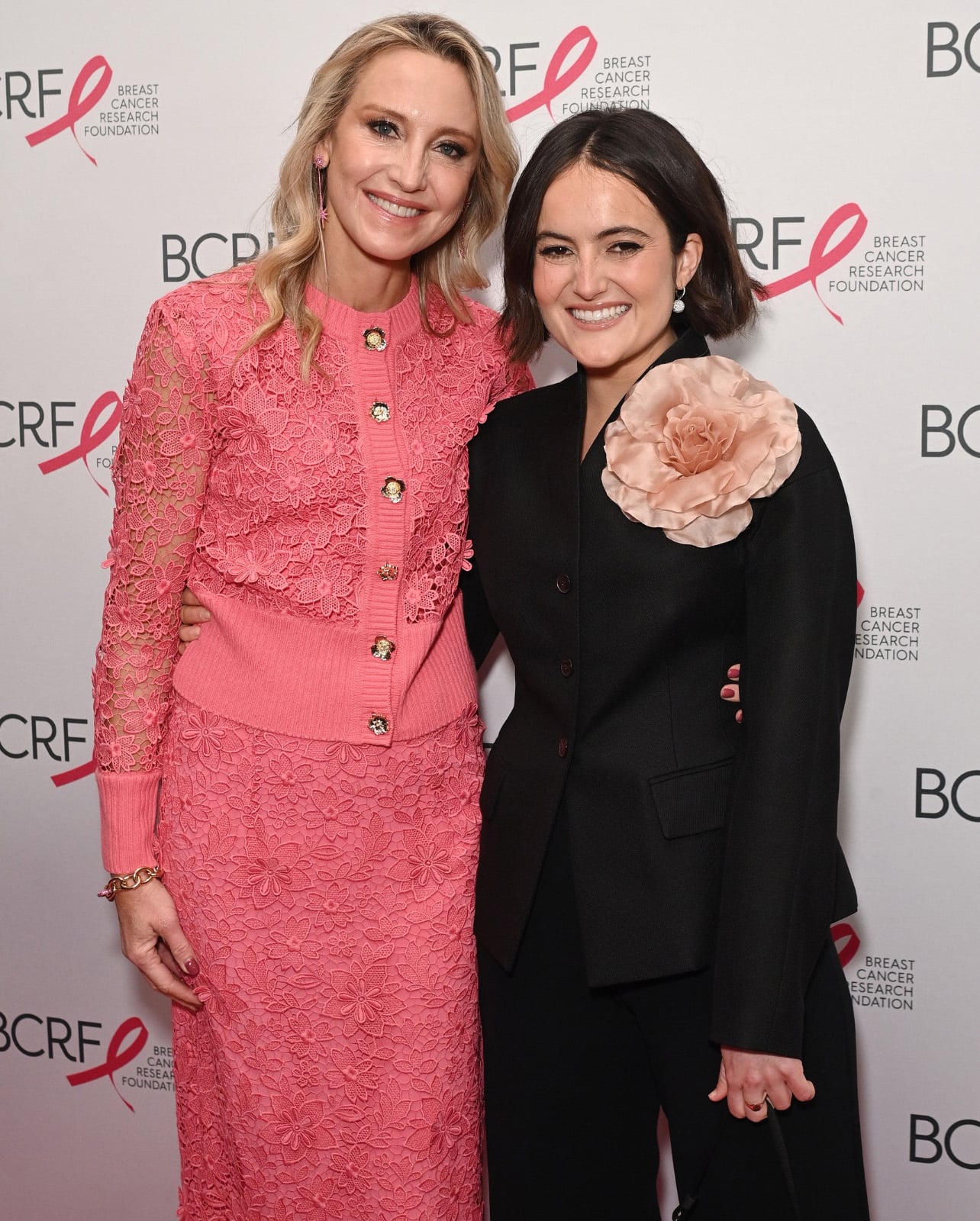 Woman in pink dress next to woman in black dress