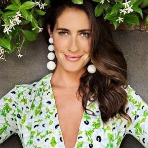 Designer Rebecca de Ravenel sporting her Les Bonbons earrings available at The Webster