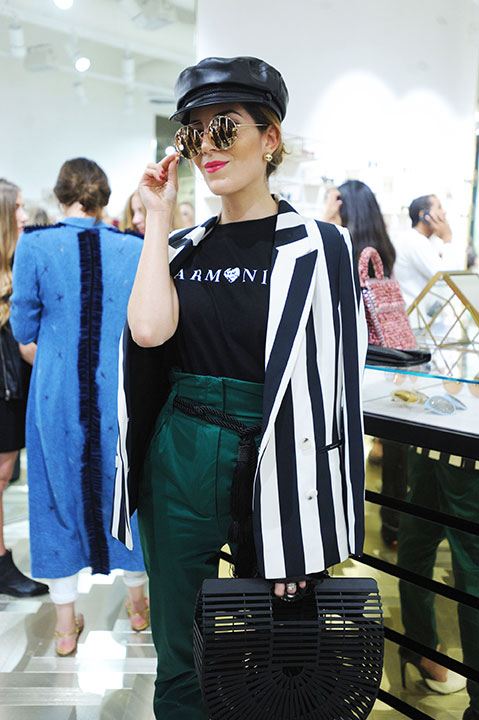 Fashion influencer and stylist Gabriela Medina sporting Linda Farrow's Round sunglasses.