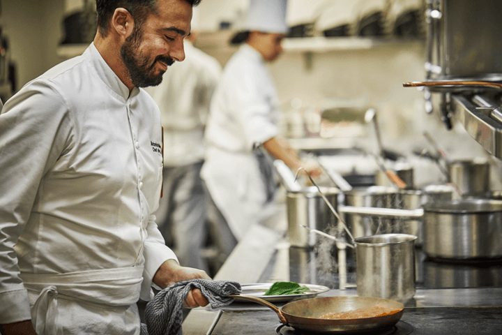 Antonio Mermolia, Le Sirenuse head chef artfully prepares one of his signature dishes.