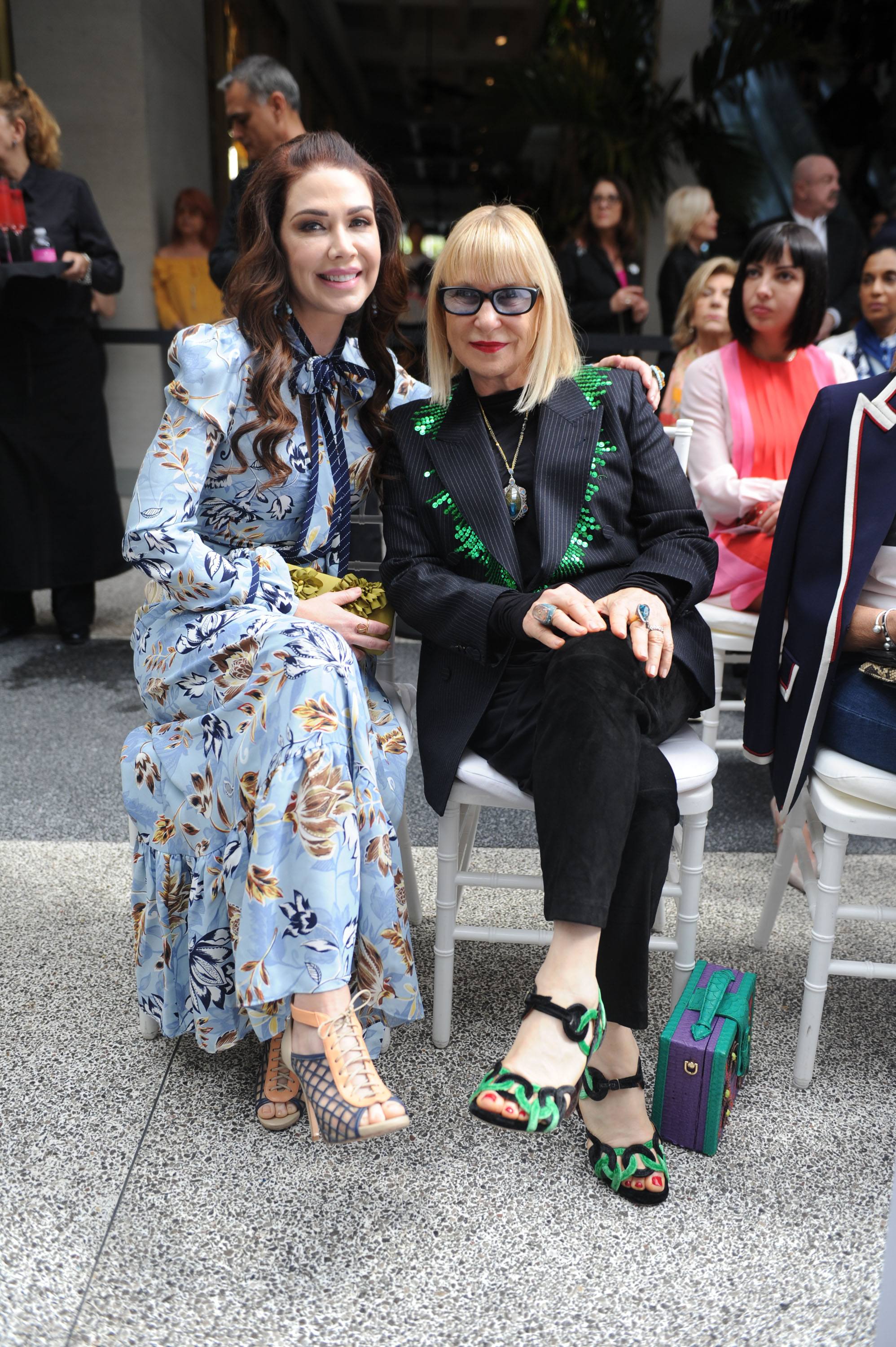 Guests Shireen Sandoval & Elysze Held sit front row during fashion show
