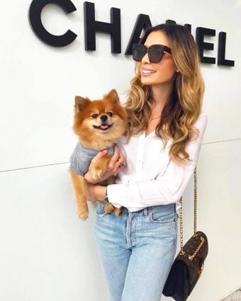 Influencer Jasmine Tosh in front of Chanel Bal Harbour with her pup