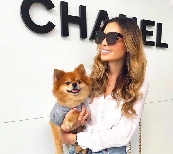 Influencer Jasmine Tosh in front of Chanel Bal Harbour with her pup