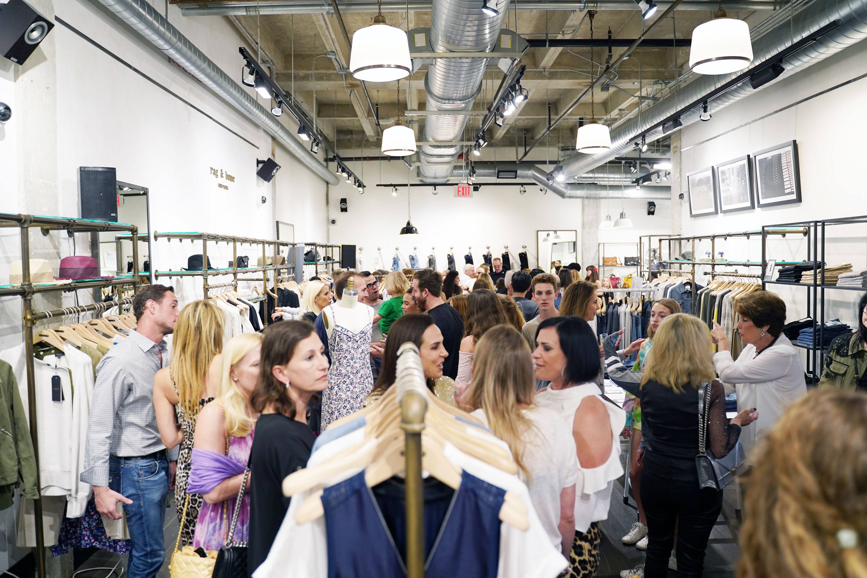 Ambiance image of guests at Rag & Bone Bal Harbour enjoying the fundraiser for The Childhood Cancer Project