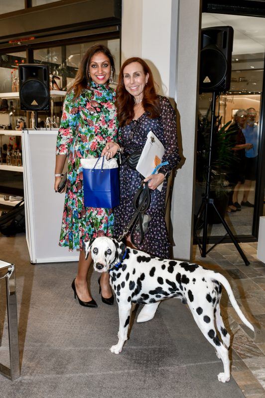 Guest posing for a picture with a beautiful Dalmatian inside Neiman Marcus Bal Harbour