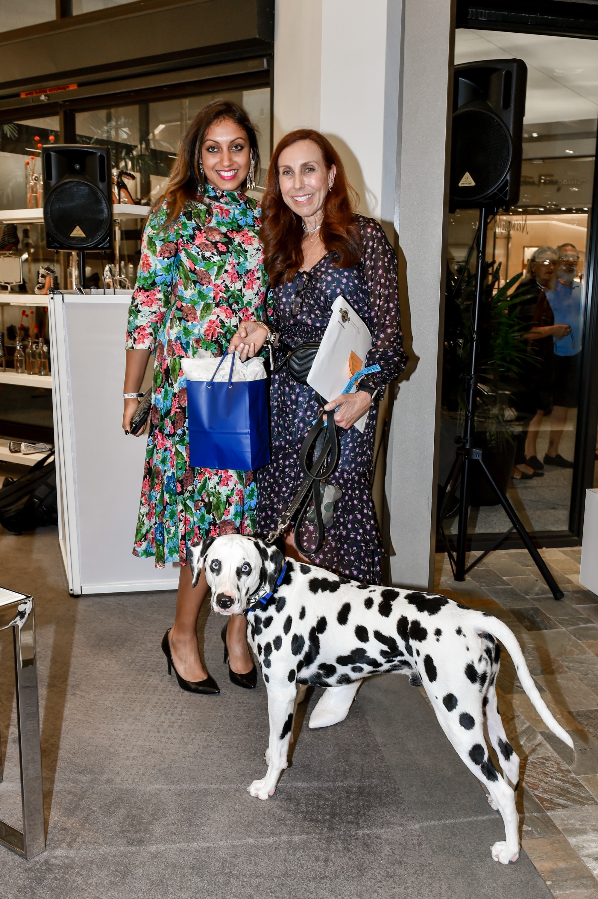 Guest posing for a picture with a beautiful Dalmatian inside Neiman Marcus Bal Harbour