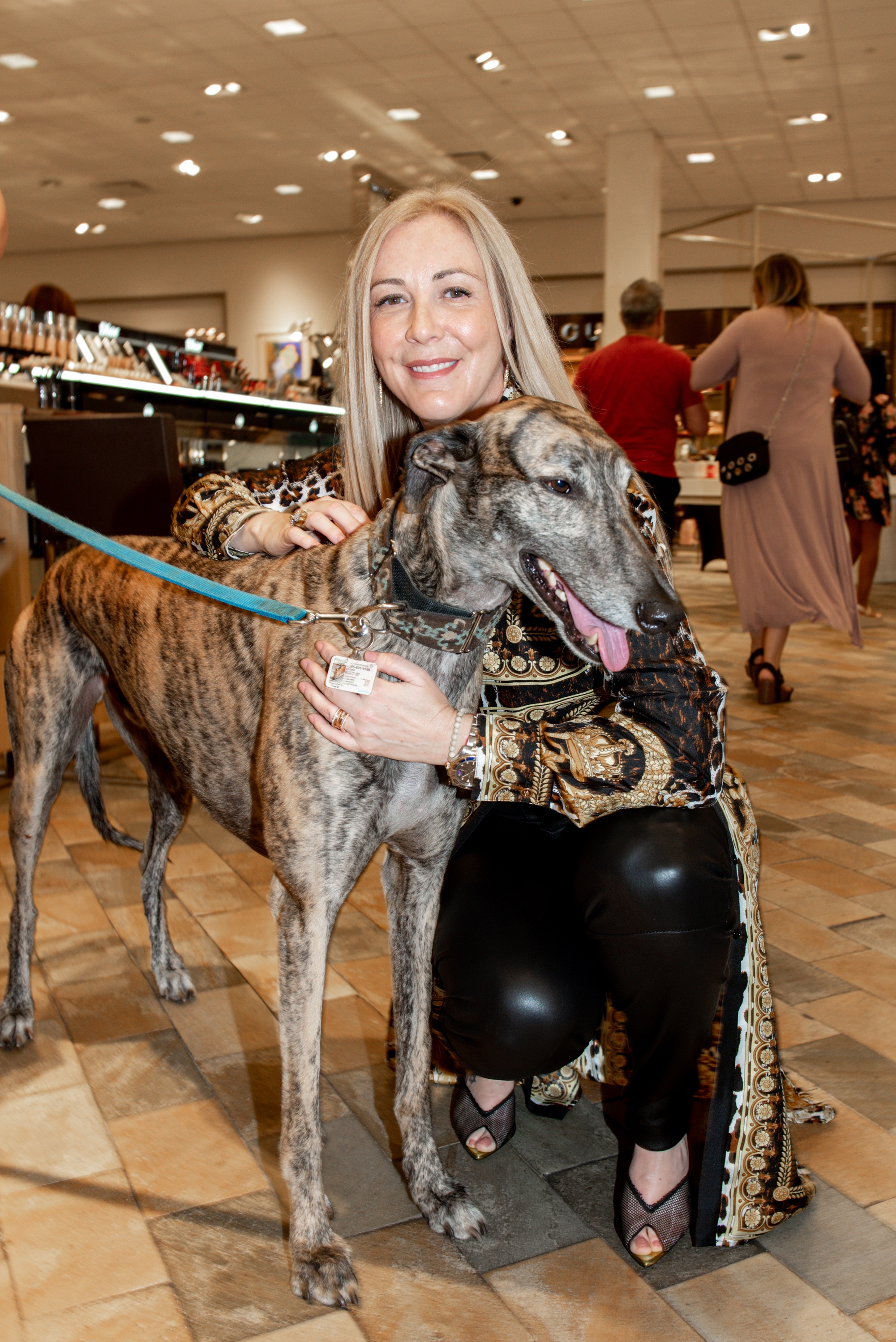 Angela Birdman with her dog at Neiman Marcus Bal Harbour for Walk in Style for the Animals