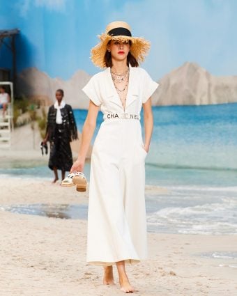 A runway look in a white jumpsuit from Chanel's Spring 2019 runway