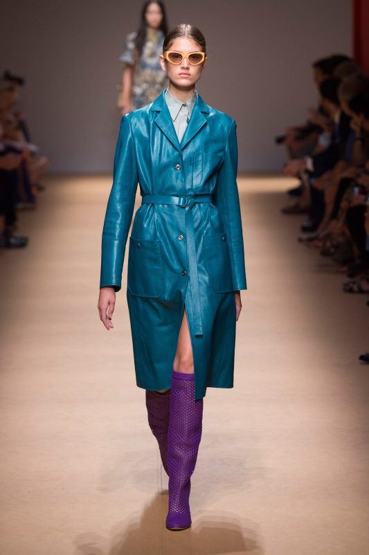 Salvatore Ferragamo Spring 2019 runway look, blue leather coat and purple knee-high boots