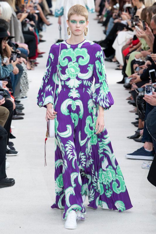 Valentino Spring 2019 runway look, purple pleated long-sleeve gown with mint green and white geometrical shaped prints