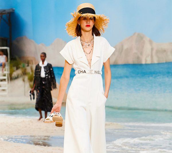 A runway look in a white jumpsuit from Chanel's Spring 2019 runway
