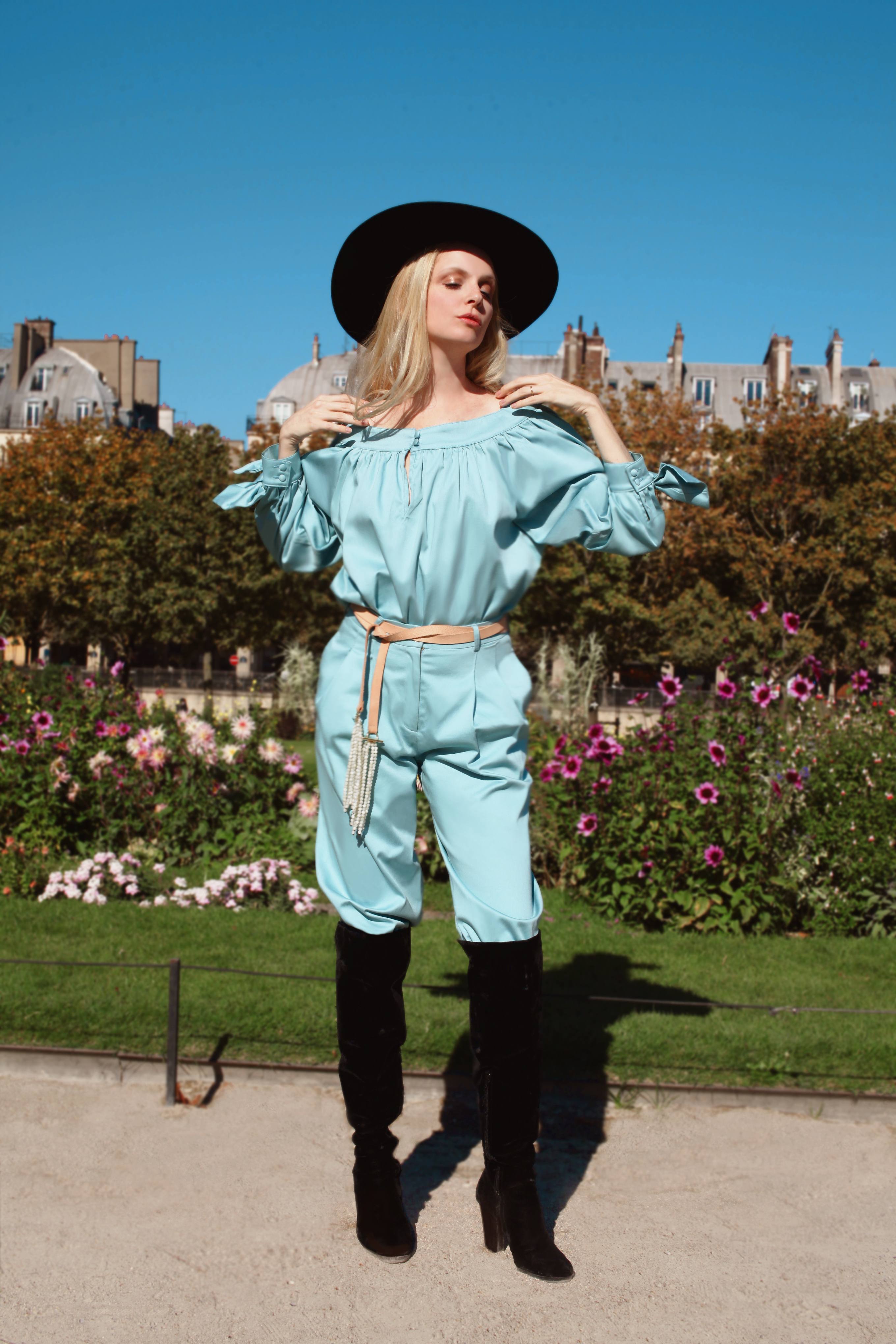 Sofia Achaval De Montaigu wearing Desnuda top in Light Blue Cotton Satin paired with Al Boleo pants in Light Blue Cotton Satin and styled with the Tientos belt