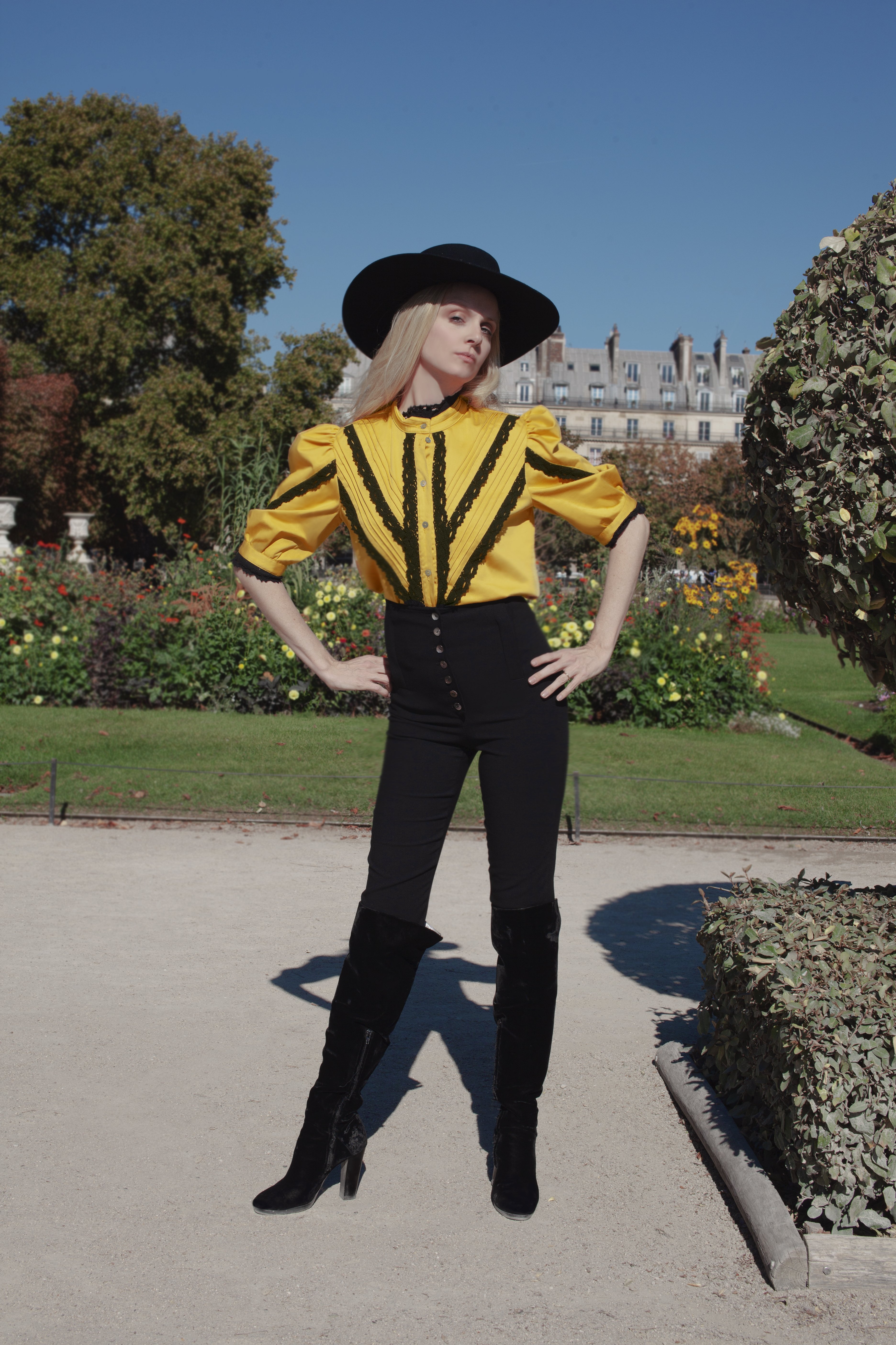 Sofia Achaval De Montaigu wearing Yegua Shirt in Yellow Cotton Satin paired with Palo pants in Black Cotton Satin and styled with the Gaucho Hat