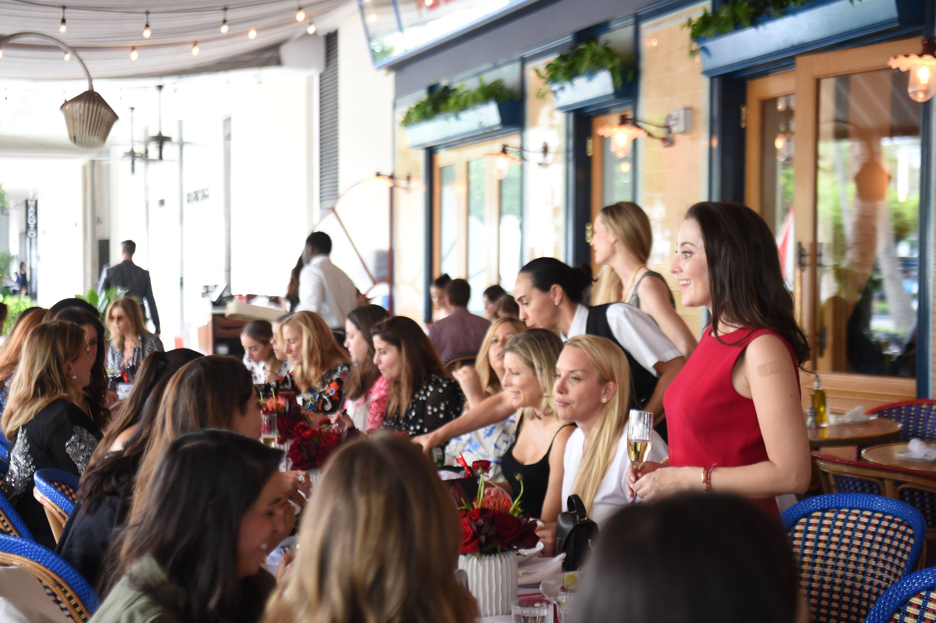 Susanna Birbragher speaking at Wine, Women and Shoes luncheon at Le Zoo Bal Harbour