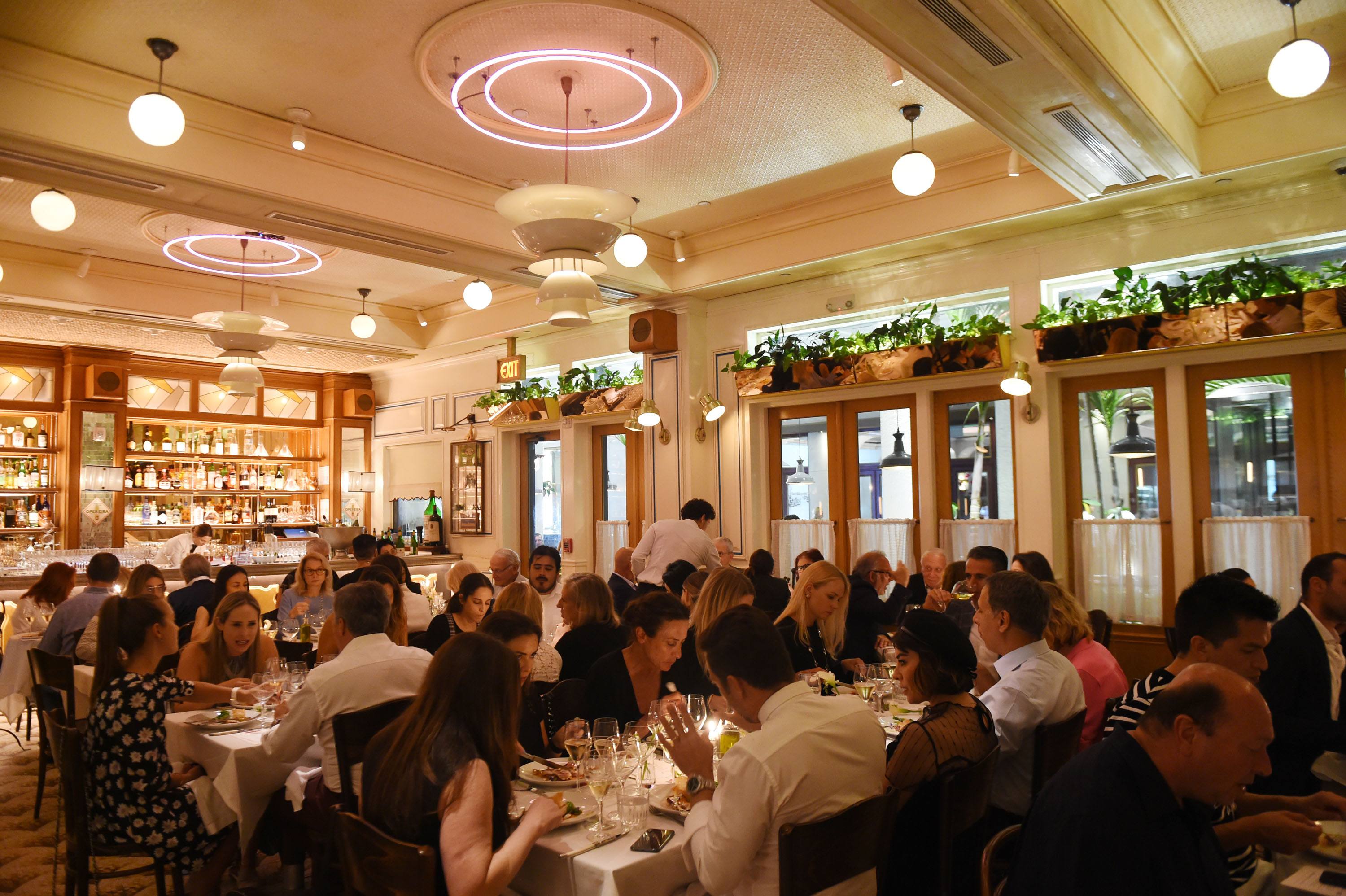 Guests enjoying a spectacular meal at Haute Cuisine hosted at Le Zoo Bal Harbour