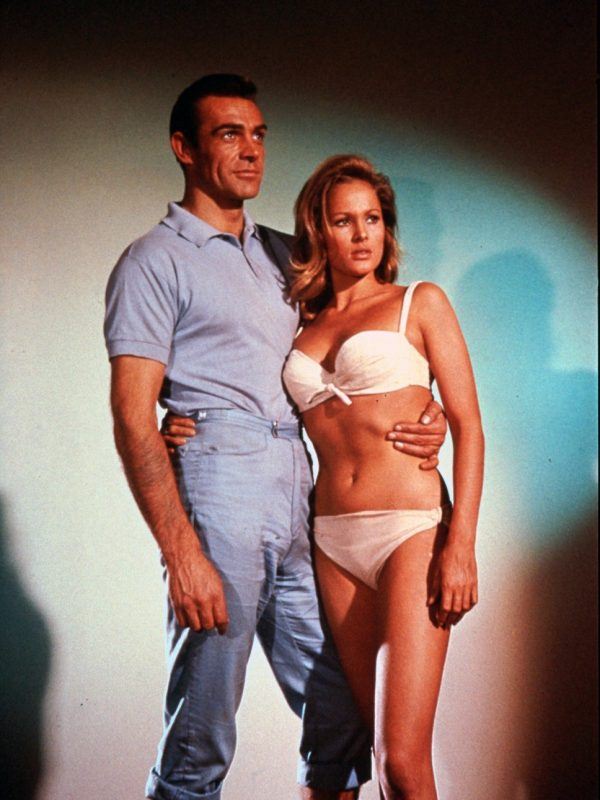 Actor Sean Connery as James Bond posing with actress Ursula Andress as Honey Ryder in the first James Bond film, Dr. No