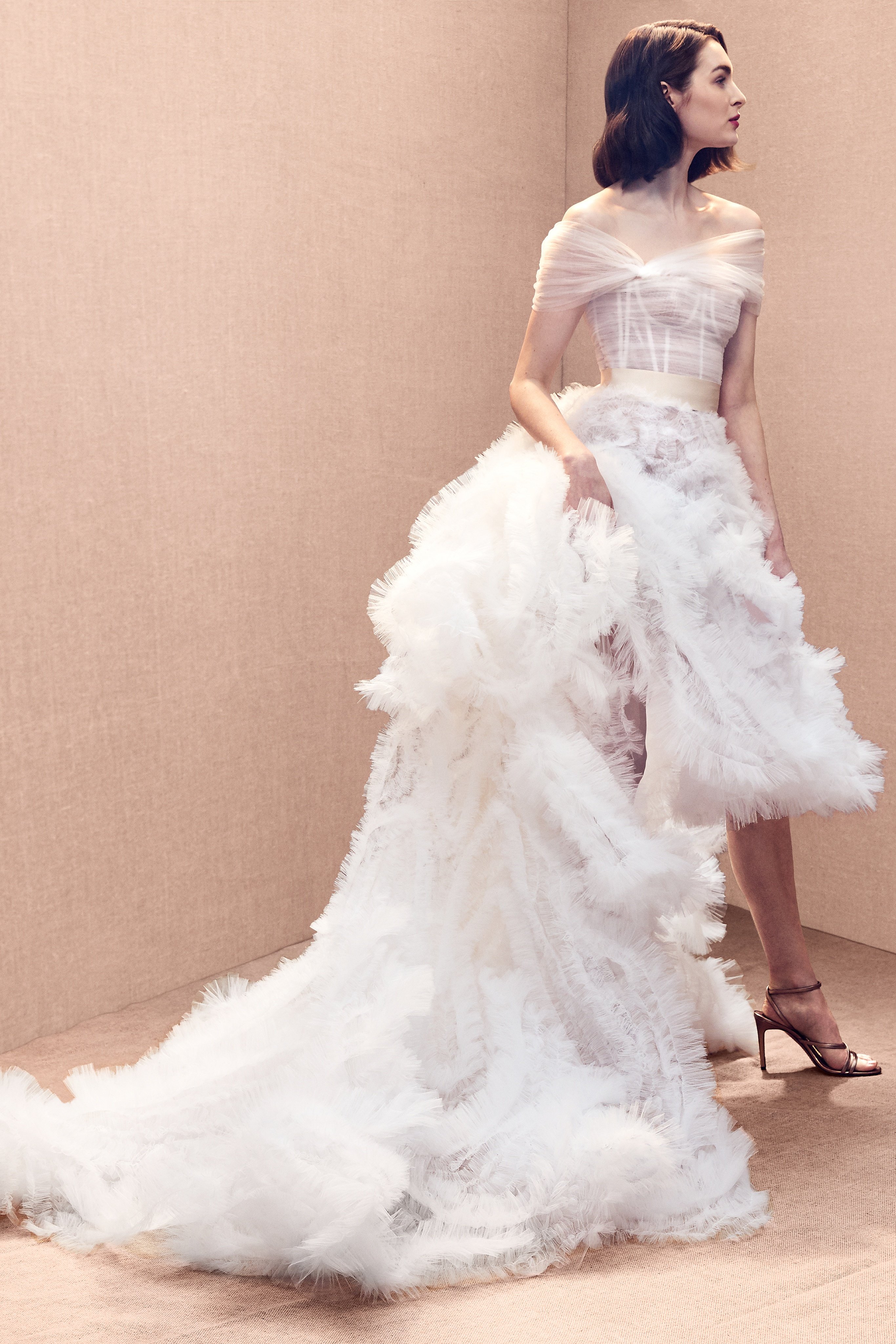 Off-the-shoulder bustier ballgown with embroidered tulle skirt.