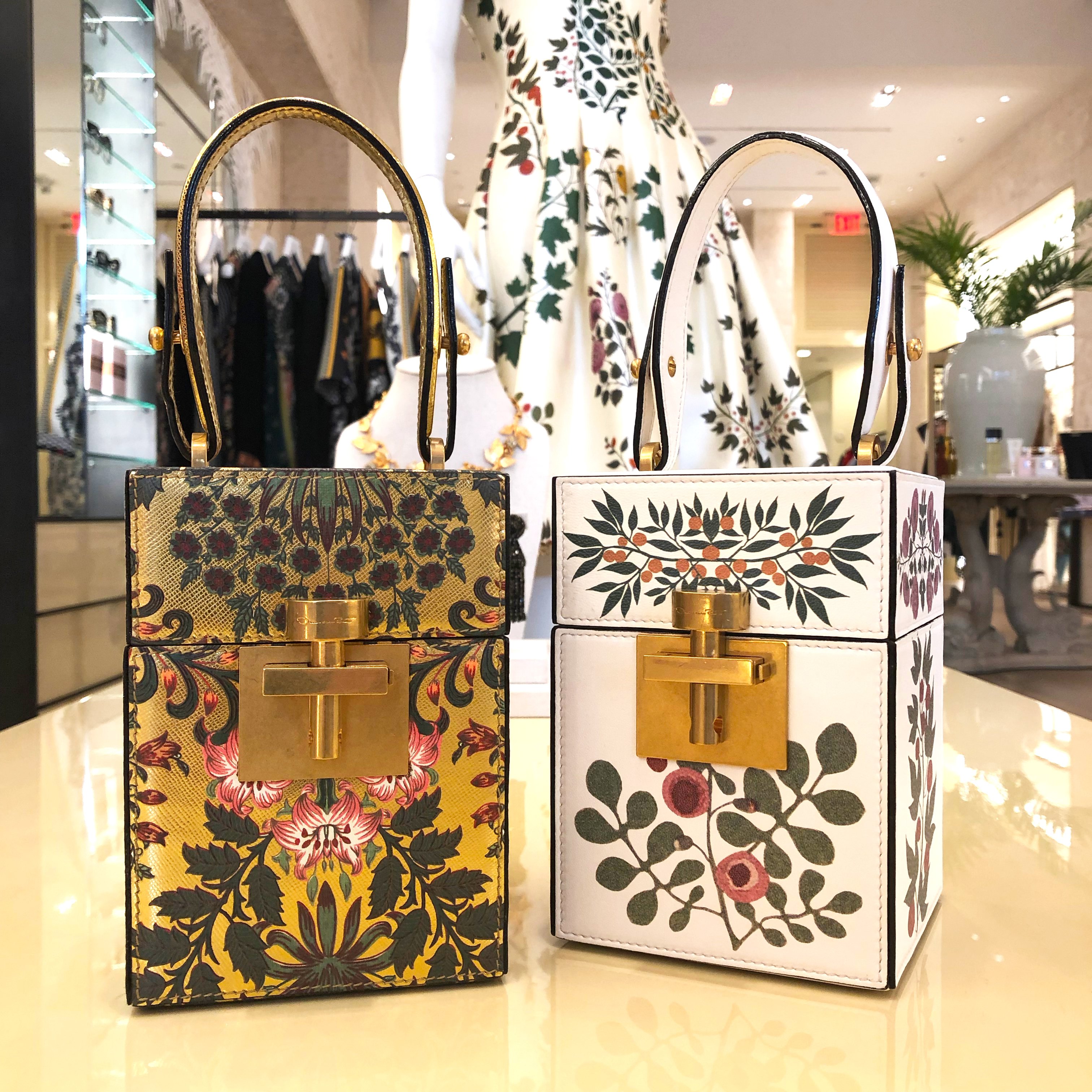 Oscar de la Renta Mini Alibi Bag inspired by vintage travel trunks, the Alibi bag is crafted from printed gold leather and printed shell leather with a lock clasp and a tonal top handle