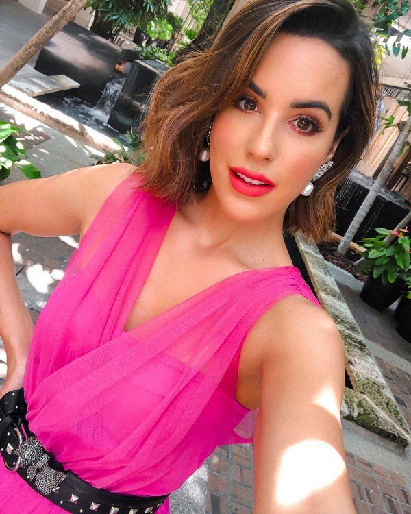 @kellysaks in a PINKO sheer pink mini dress