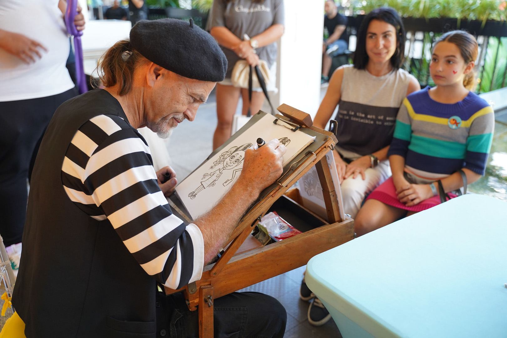 Caricature artist on Level 2 of Bal Harbour Shops for ICE CREAM WE LOVE 2020