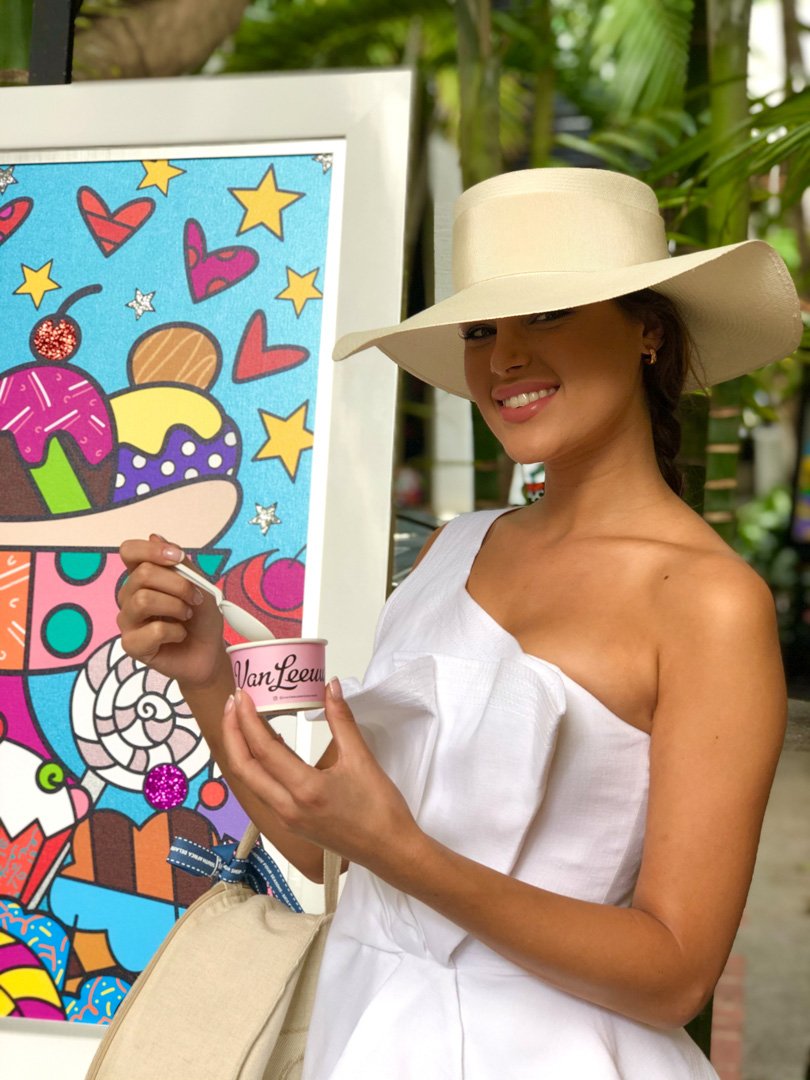 100% Capri model enjoying Van Leeuwen Ice Cream in front of the Britto Pop-Up for ICE CREAM WE LOVE 2020