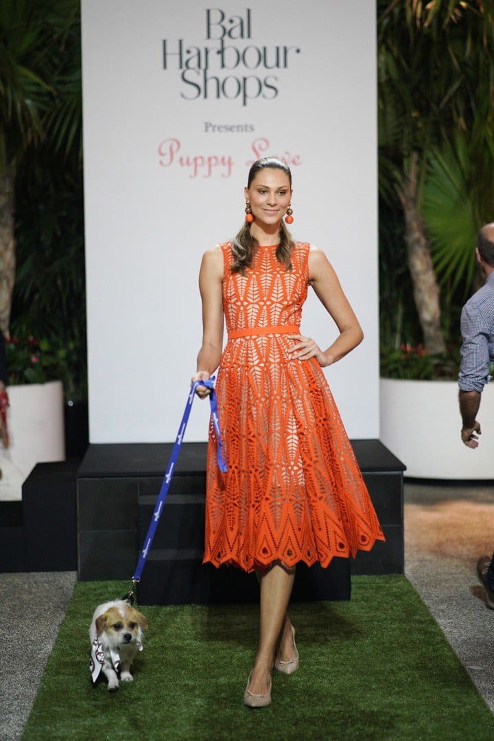 Oscar de la Renta model and featured dog walking the puppy runway