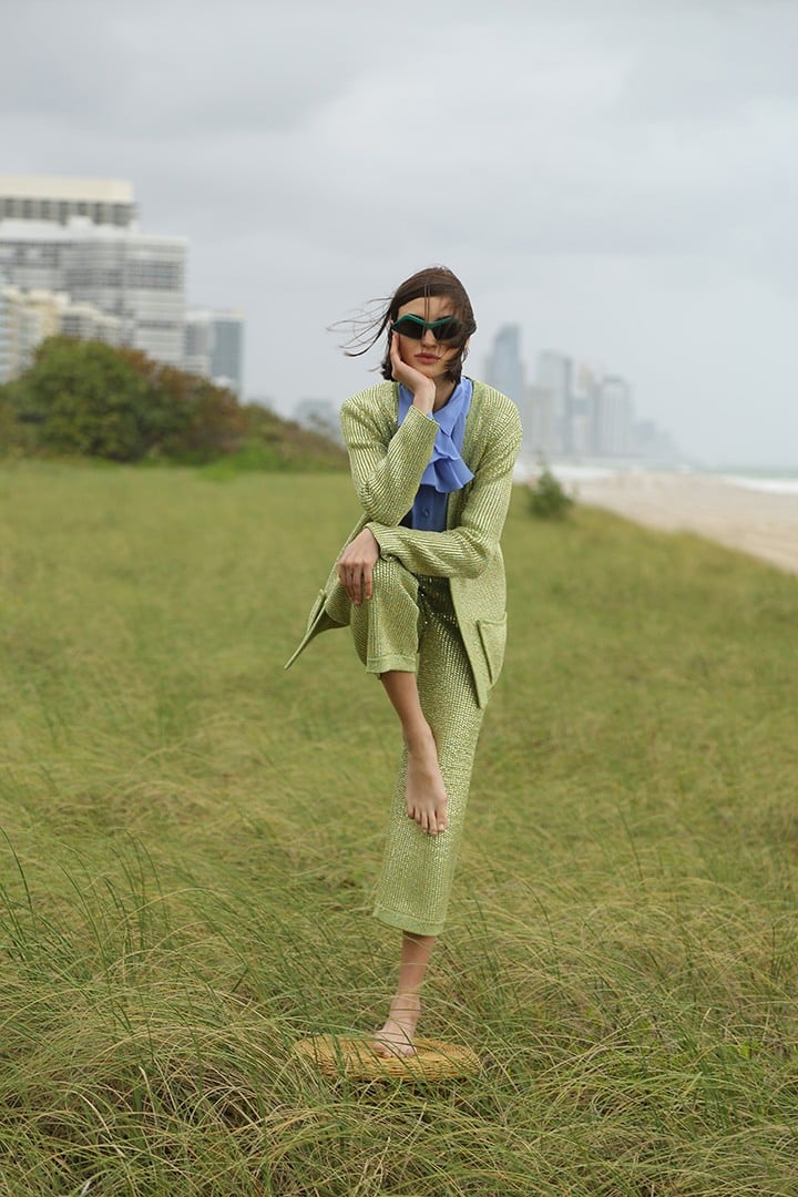 Gucci silk chiffon ruffle blouse, green knit jacket and cropped pant and Stella McCartney sunglasses