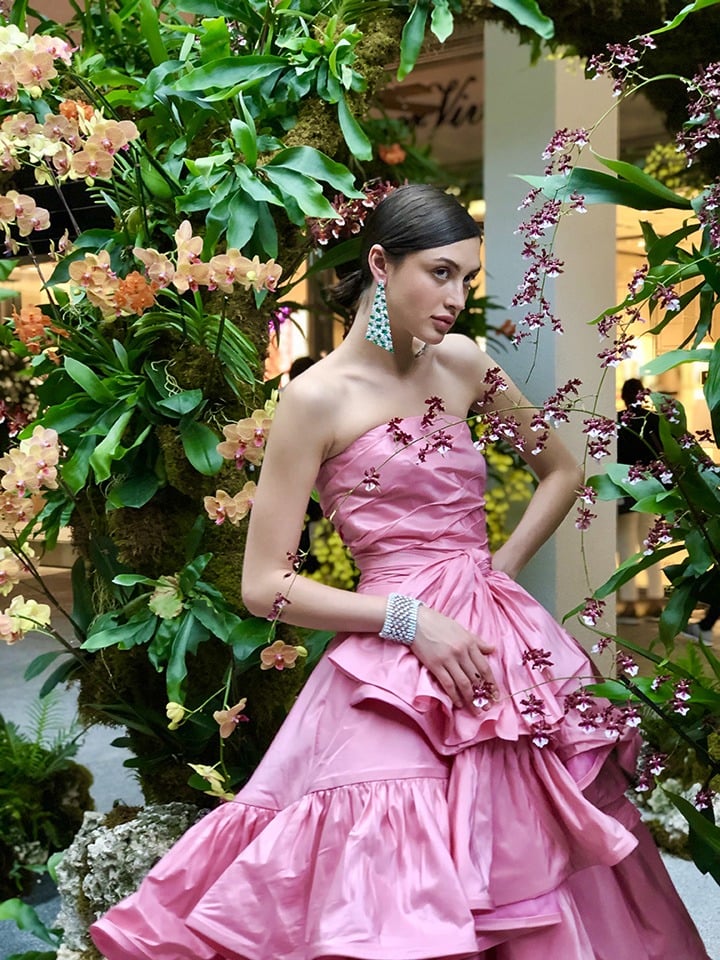 Model Alina Kozyrka wears an Oscar de la Renta gown and Graff emerald and diamond Abstract earrings.