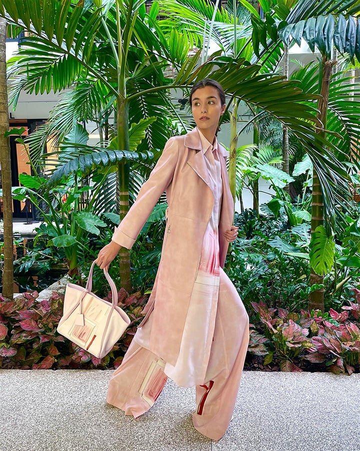 Akris Olesia nappa leather trench coat, silk crêpe print tunic shirt dress, Floretta ohayo print wool silk pants and Alexa handbag from the SS21 collection.