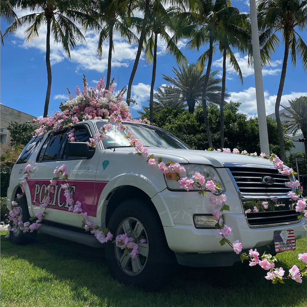 Bal Harbour Village Flower-adorned Police Car at Founder’s Circle by Alejandro Figueira