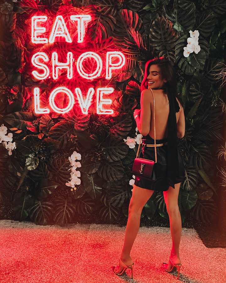 Carla Nuñez at our EAT SHOPS LOVE Instagrammable Wall Installation on Level 3 of Bal Harbour Shops.
