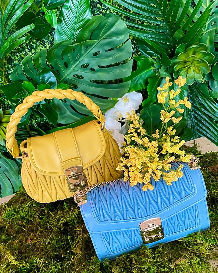 Miu Miu yellow coffer bag with braided strap and Miu Miu blue matelasse weave bag with gold chain