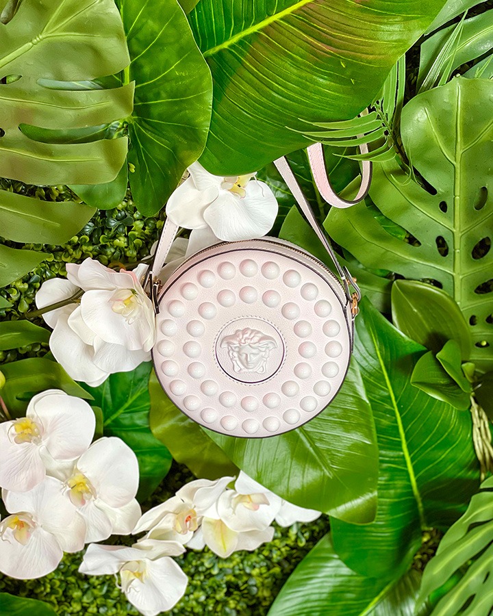 Versace’s La Medusa Studded Round Camera Bag in white leather.