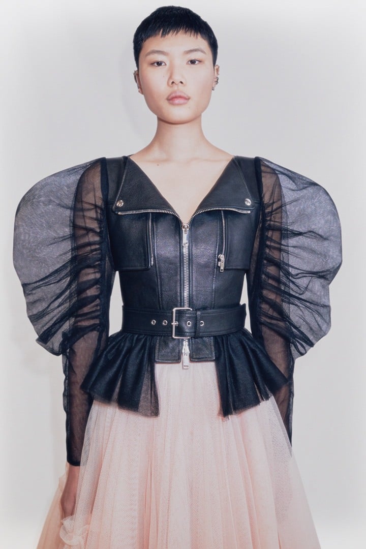 Alexander McQueen black buffalo leather biker jacket with puff tulle sleeves, boat neckline and chest zip pockets.