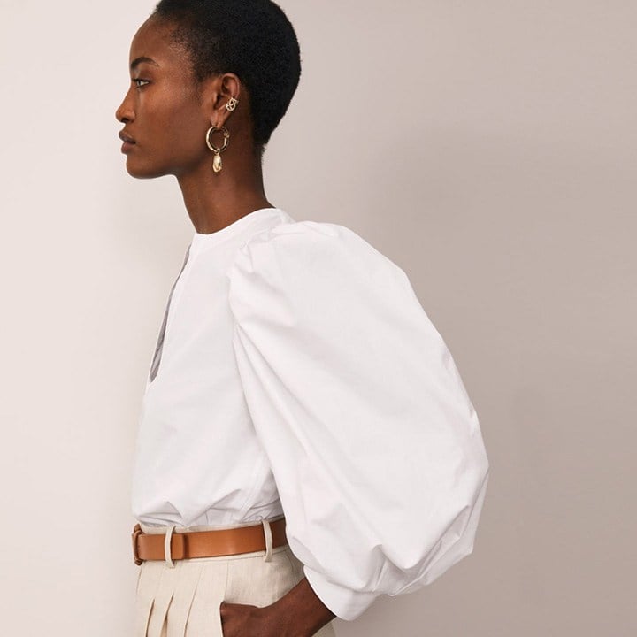 Lafayette 148 white cotton blouse with puffed sleeves and plunged neck detailing.
