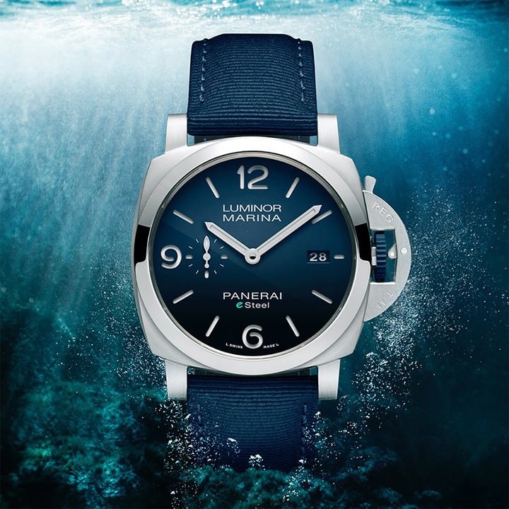 Panerai Luminor Marina eSteel watch with navy face and canvas band.