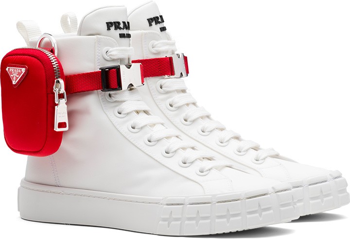 Prada Wheel Re-Nylon Gabardine high-top sneakers with red Prada pouch ankle accent.