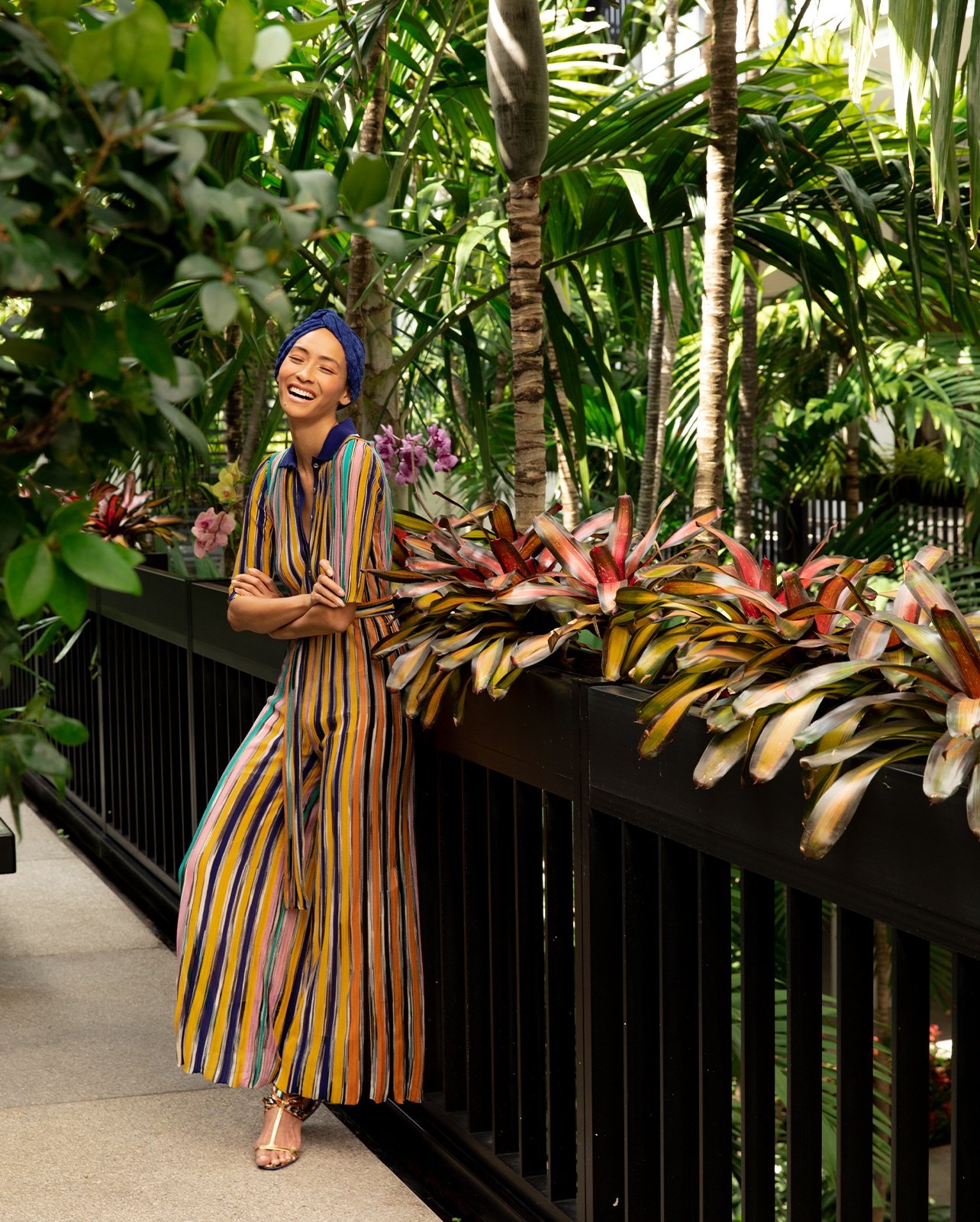 Missoni jumpsuit, multi-colored ribbon sandals and turban.