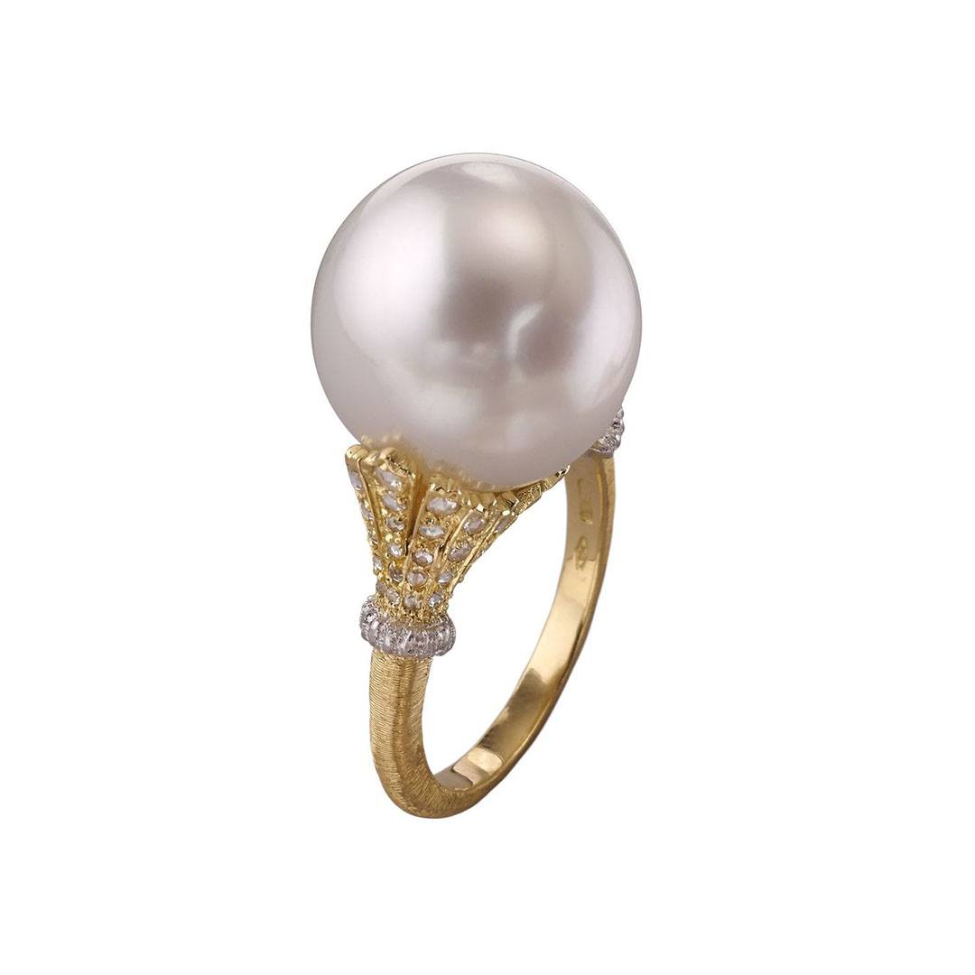 Buccellati Rolo Bolero ring with a South Sea cultured pearl set in gold with diamond pave detailing.
