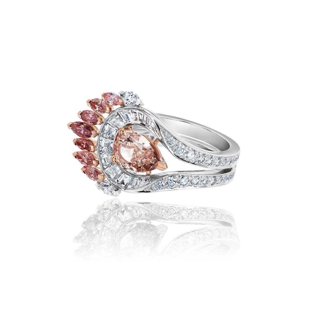 De Beers Portraits of Nature Greater Flamingo ring with a 1.55-carat fancy brown orange pear-shaped center diamond, surrounded by white baguette diamonds and nine marquise-shaped white and fancy cut diamonds.