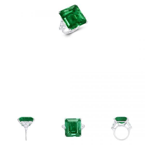Graff cocktail ring with a 21.07-carat emerald-cut emerald center stone, flanked by 3.82 carats of diamond shoulders.