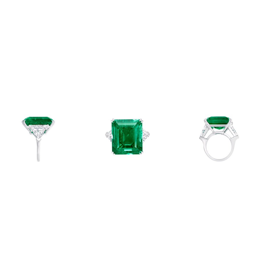 Graff cocktail ring with a 21.07-carat emerald-cut emerald center stone, flanked by 3.82 carats of diamond shoulders.