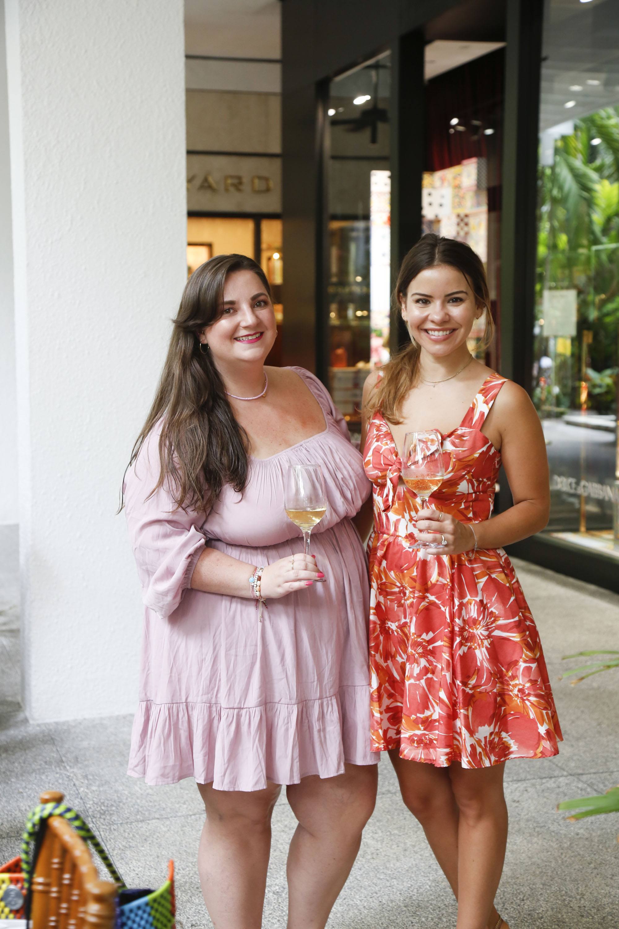 Event guests drinking white wine