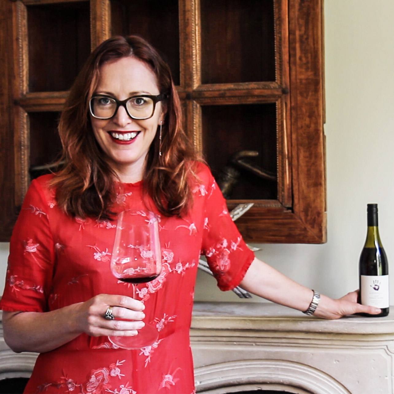 Tamra Kelly-Washington photographed with a glass of Seresin wine and bottle