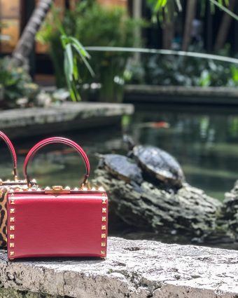 An array of Valentino Roman Palazzo box bags in red, black and leopard