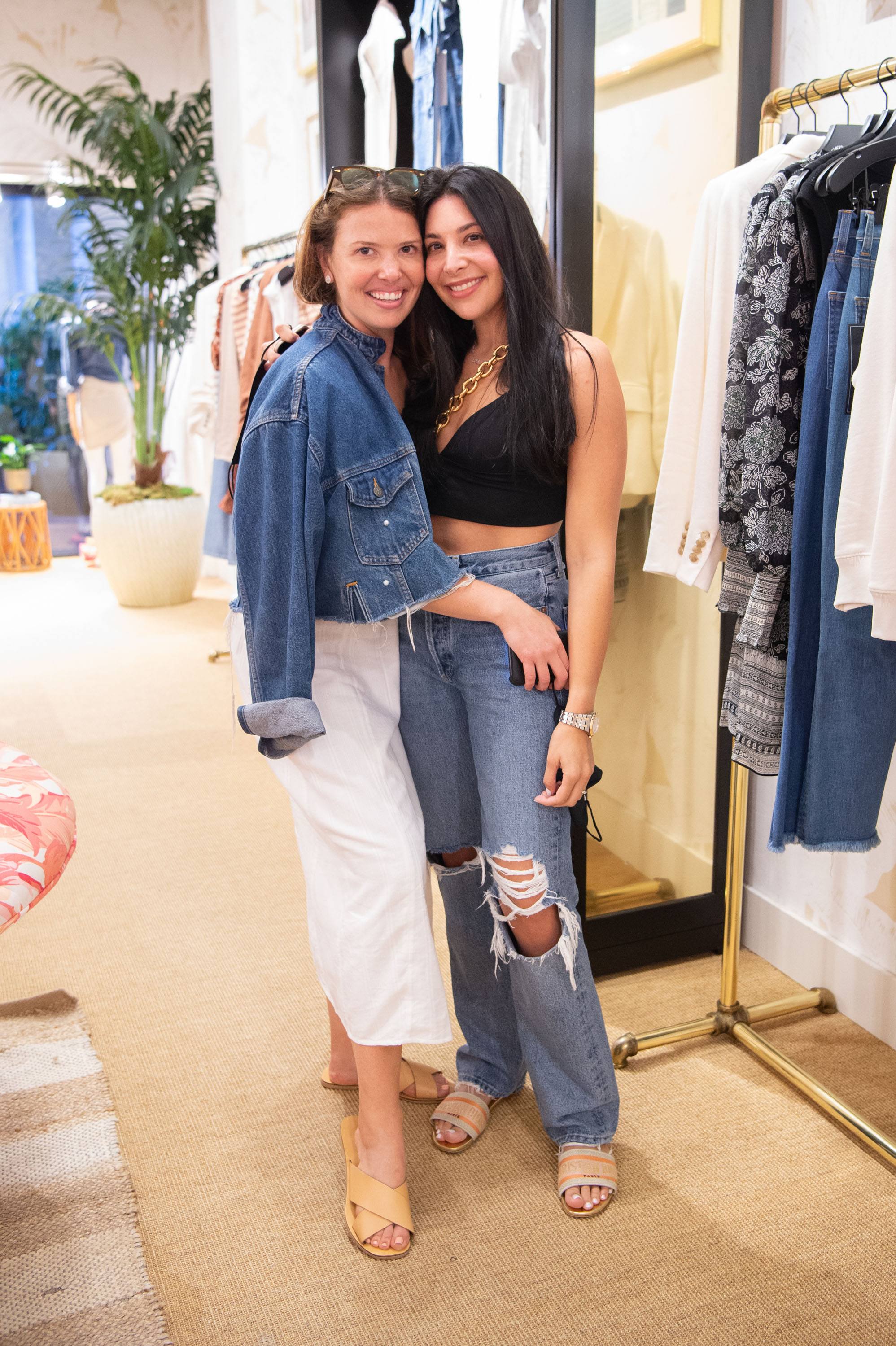 Two women pose for a photo in the Veronica Beard store