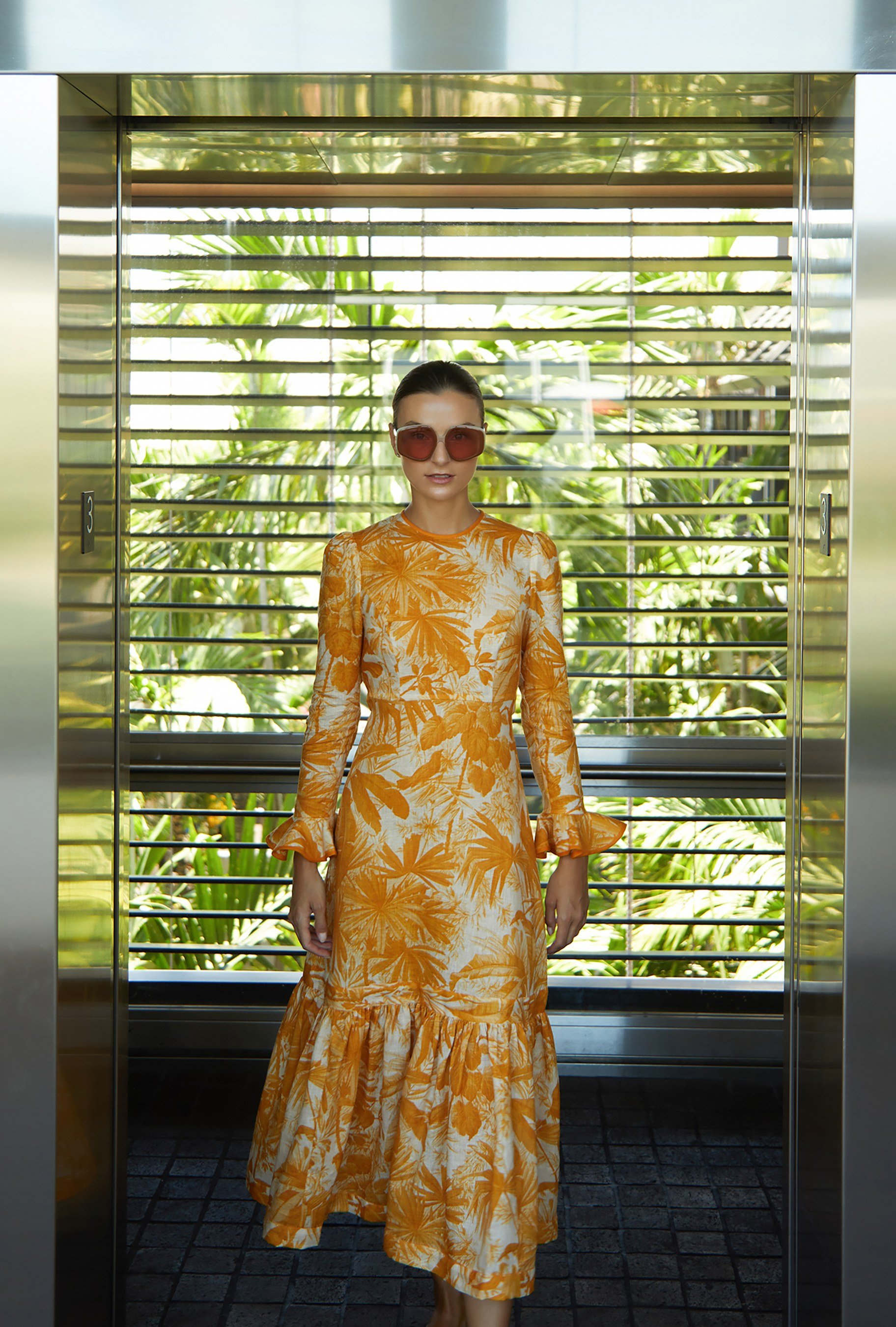 Zimmermann Mae frill yellow midi dress, brown leather ruffle heels and brown oversized sunglasses