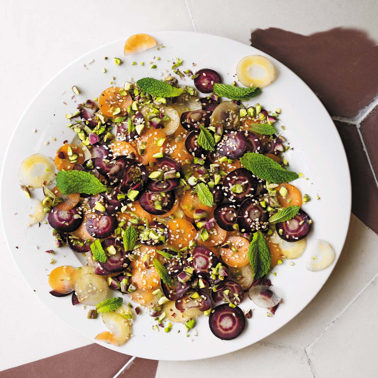 photo of a carrot with herbs and garnish on top