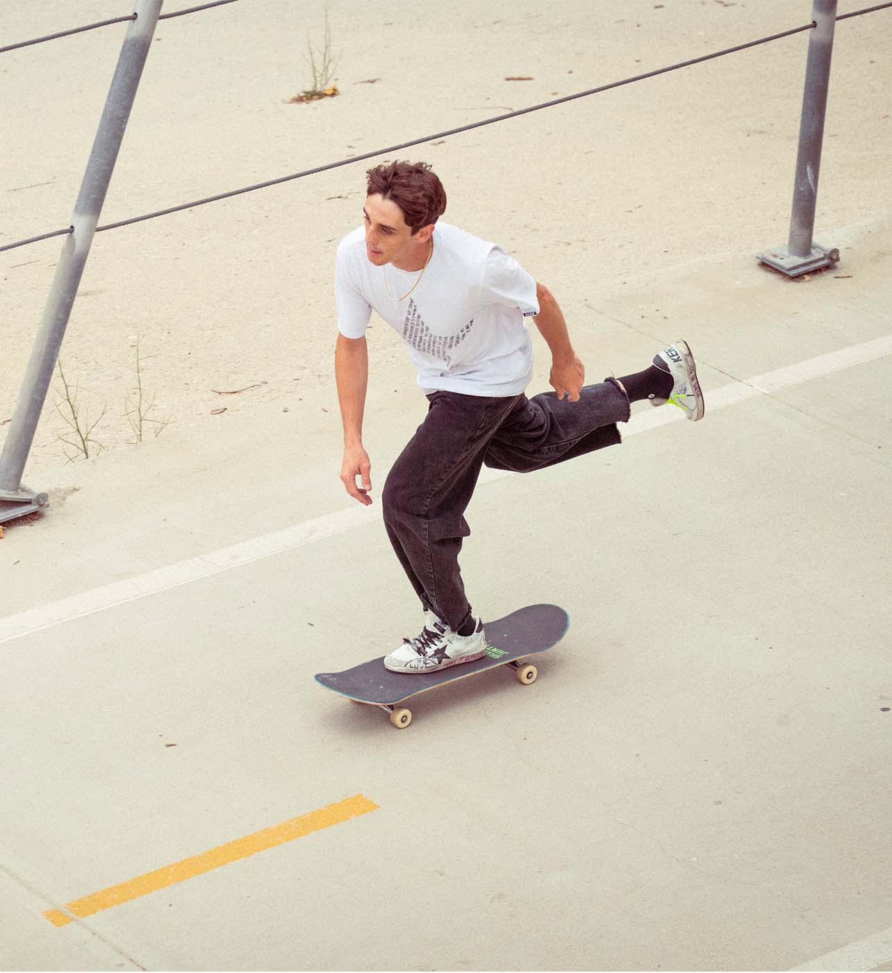 Man skateboarding wearing Golden Goose sneakers