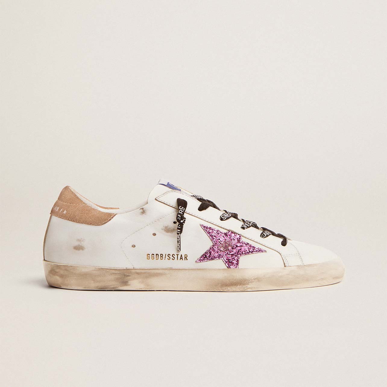 Golden Goose white sneaker with pink star detail and black laces